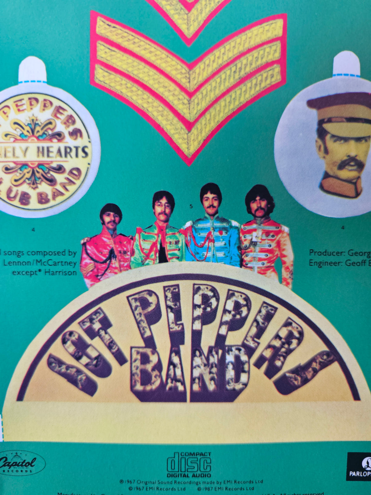 Close-up of artwork on reverse of Sgt. Pepper longbox
