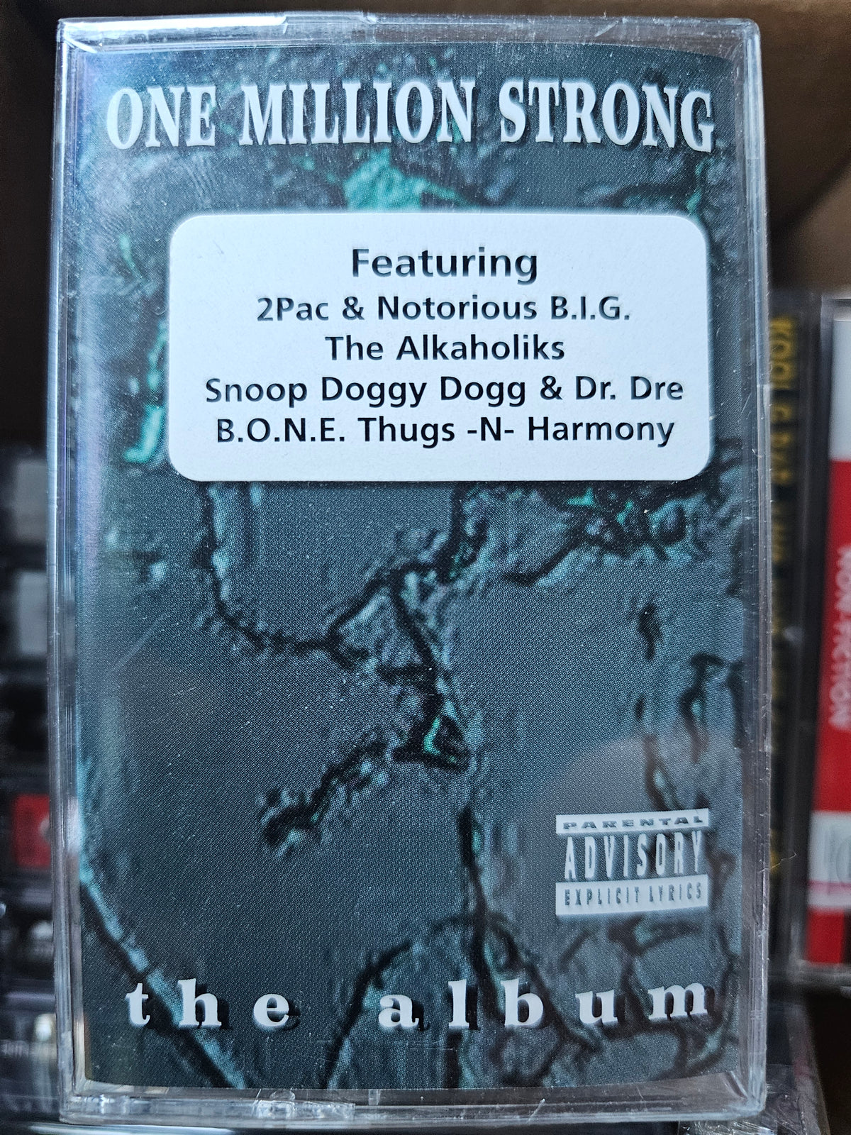 One Million Strong cassette front with featured-artist hype sticker