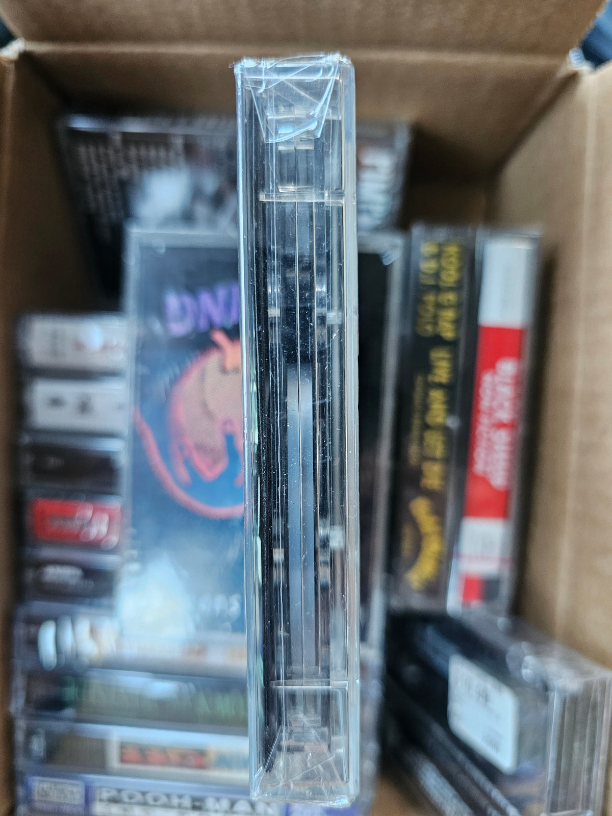 A.L.T. cassette edge showing shrink-wrap folds