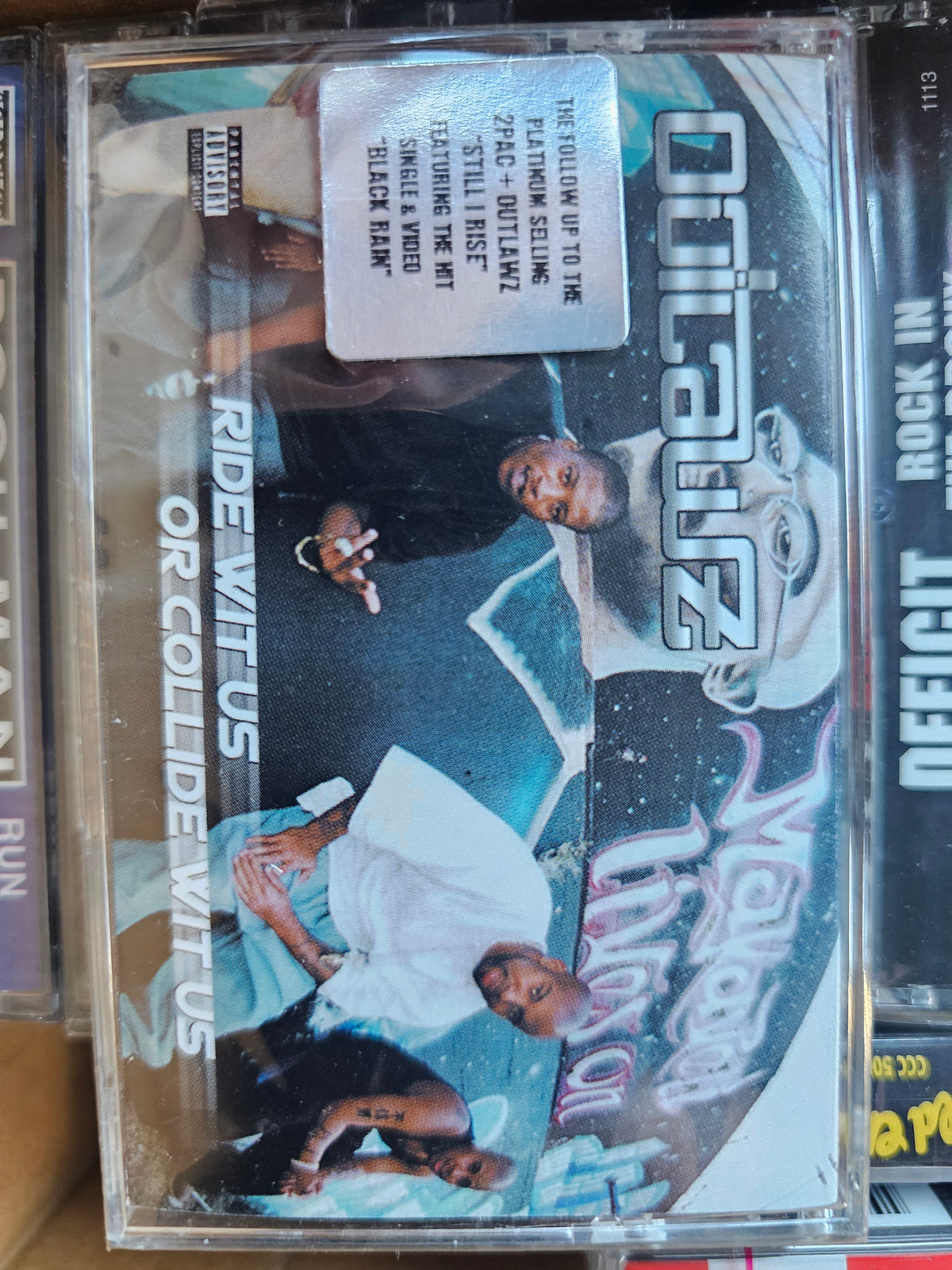 Outlawz Ride Wit Us or Collide Wit Us cassette front with hype sticker