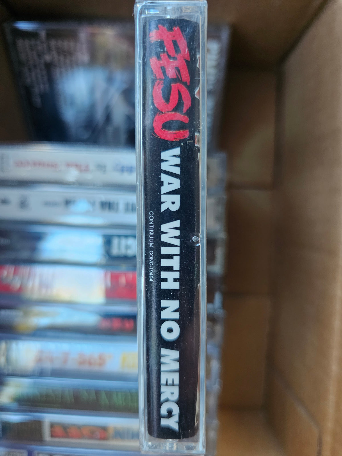 Fesu cassette back with track list and barcode-panel damage