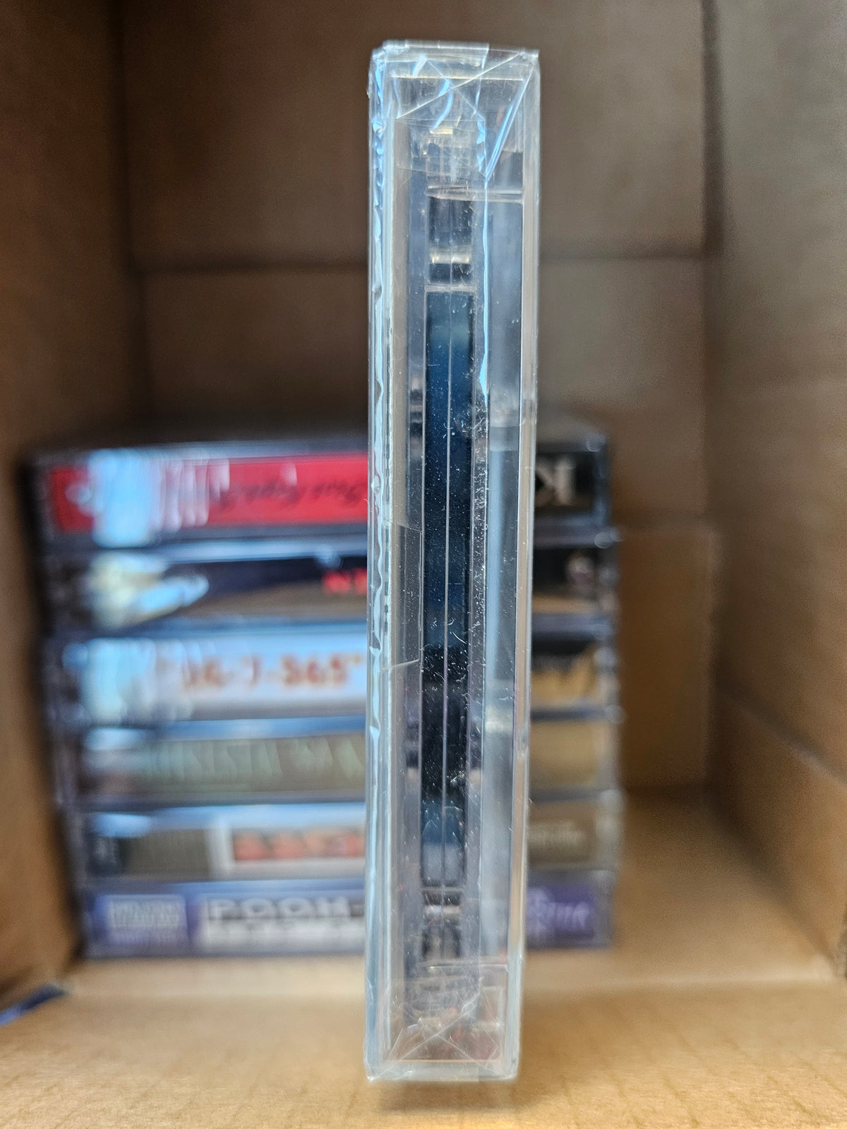 Deficit cassette back with track list and retail labels