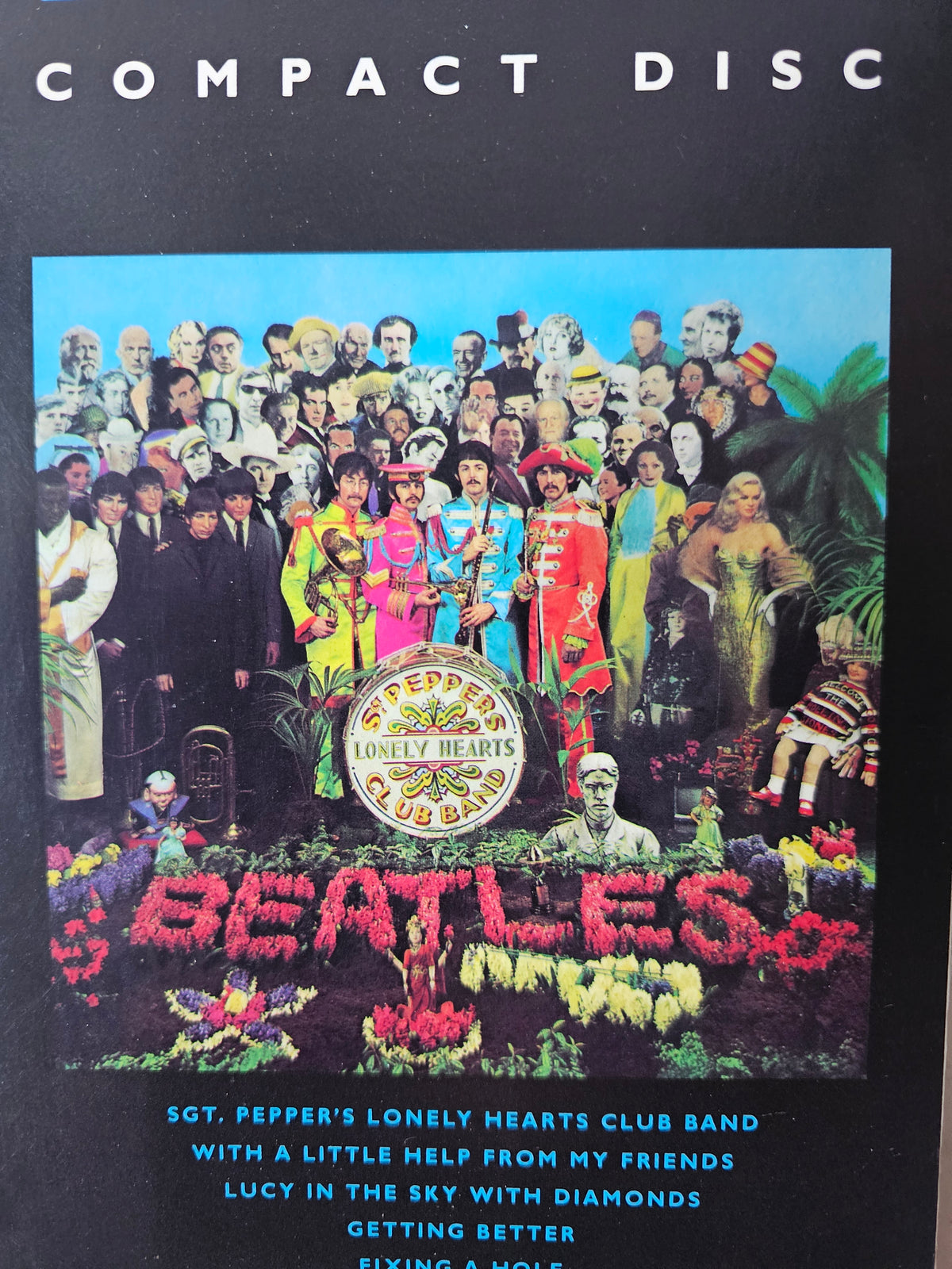 Close-up of Sgt. Pepper album artwork on longbox