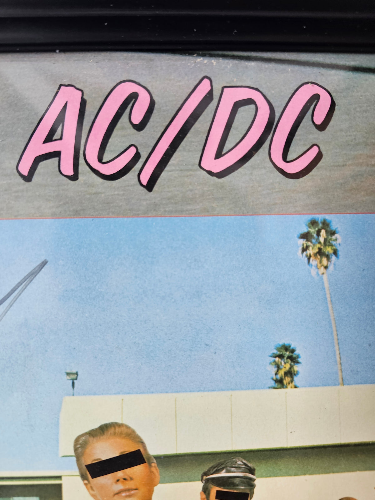 Close-up of signature and inscription on AC/DC cover