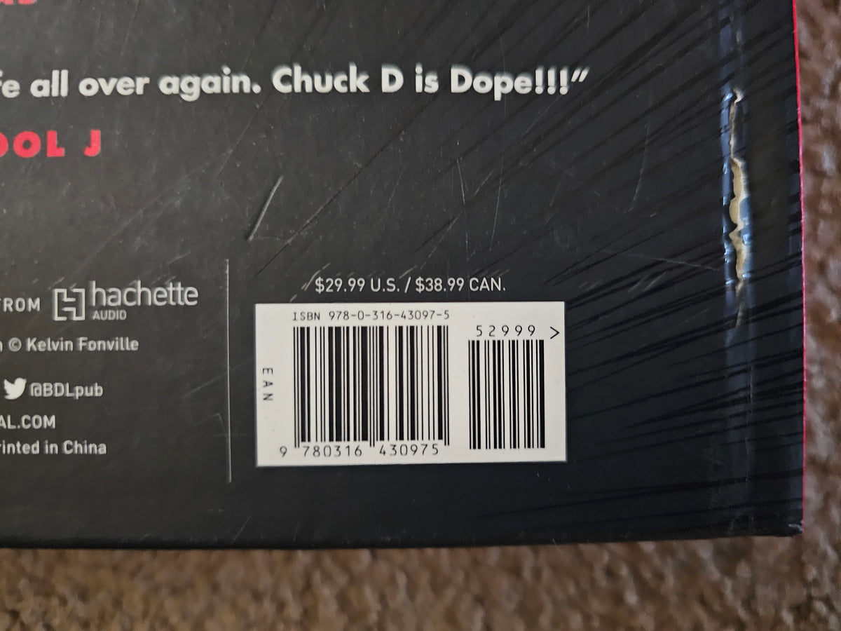 Close-up of ISBN 9780316430975 and tear in wrapping on the back-right edge