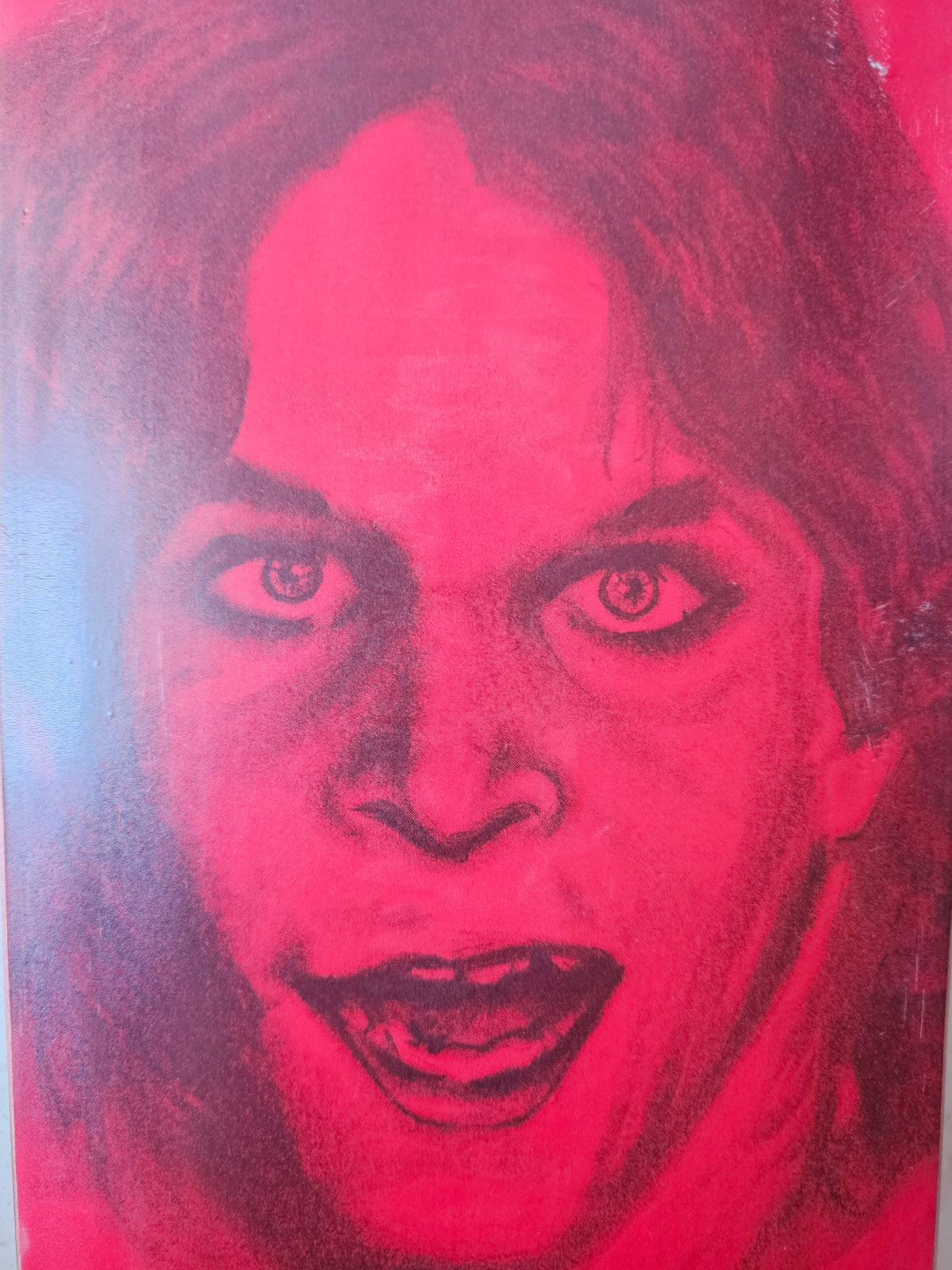 Close-up of portrait graphic and visible surface marks