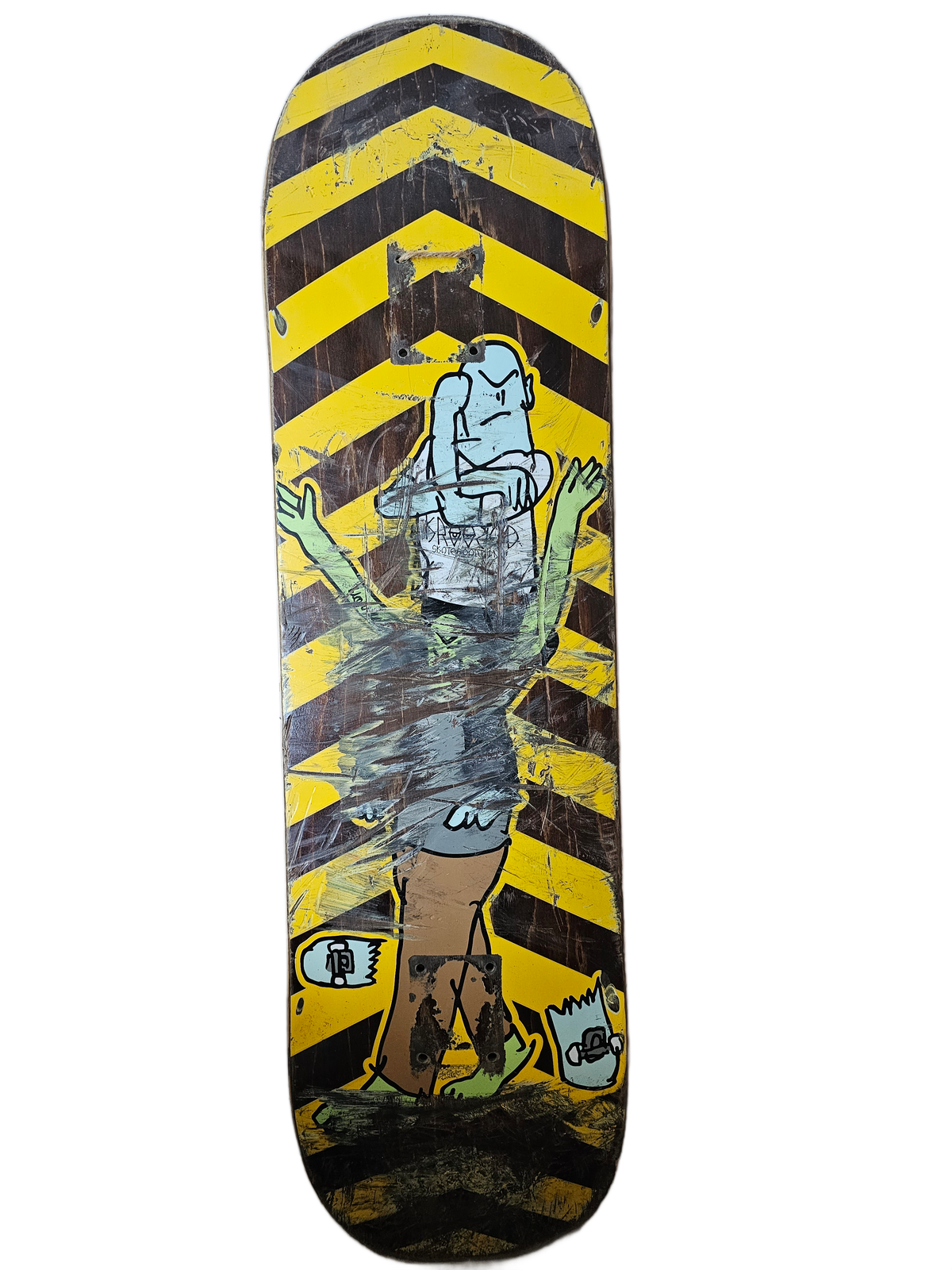 Cutout view of worn Krooked yellow chevron skateboard deck