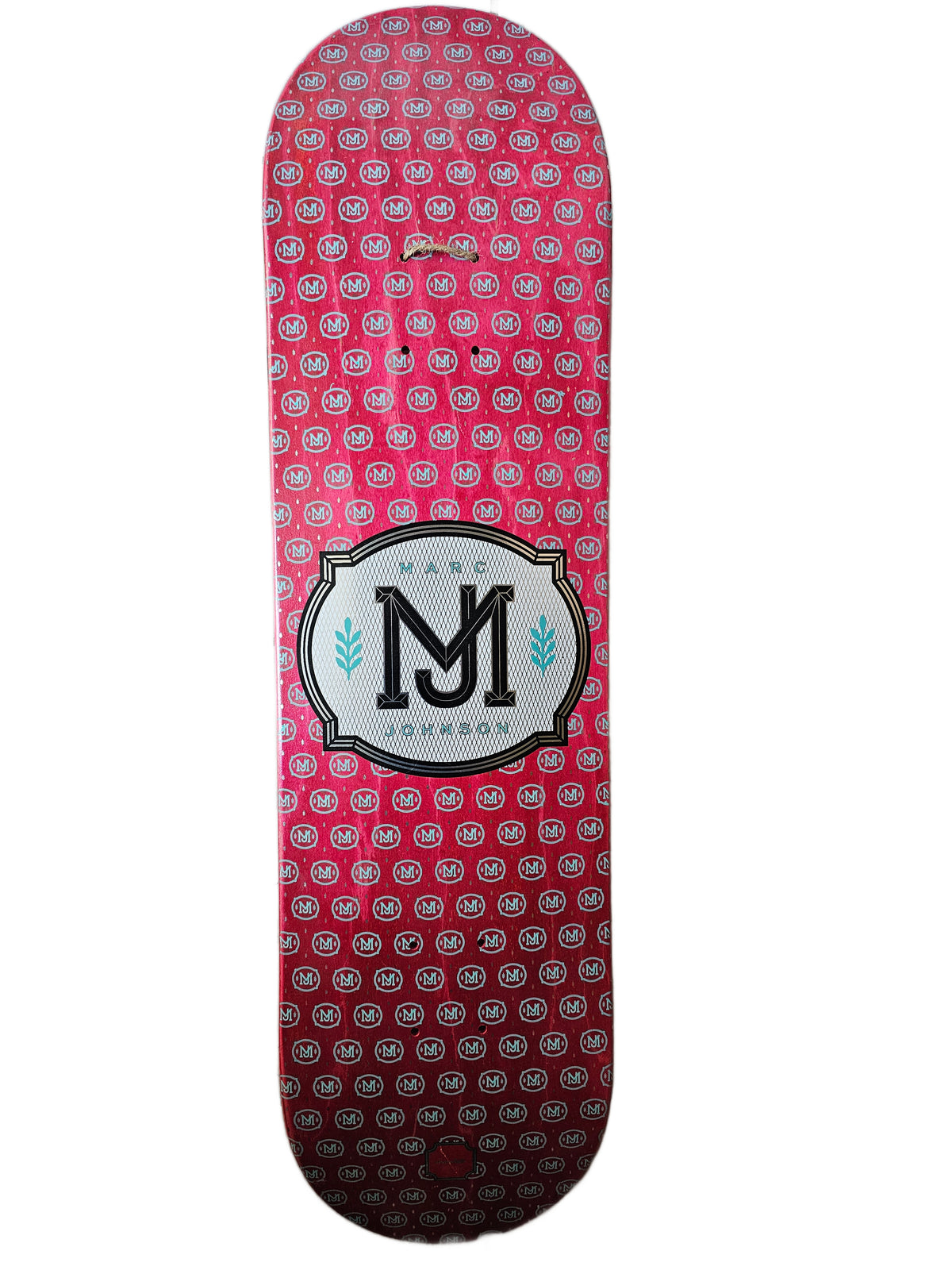 Chocolate Marc Johnson deck with repeating MJ monograms and central crest