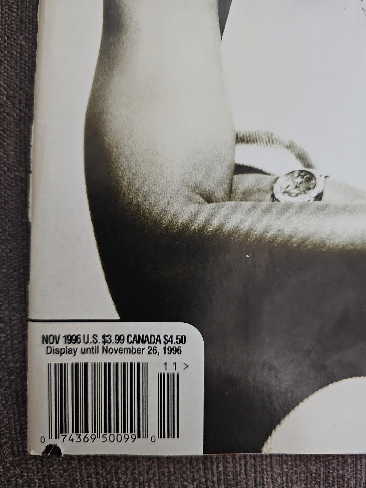 November 1996 date and barcode close-up showing bottom-edge paper loss