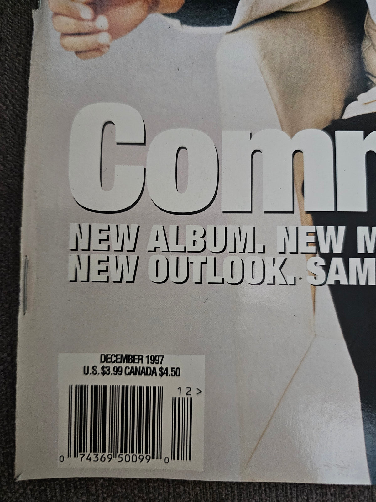 December 1997 date close-up showing diagonal front cover crease
