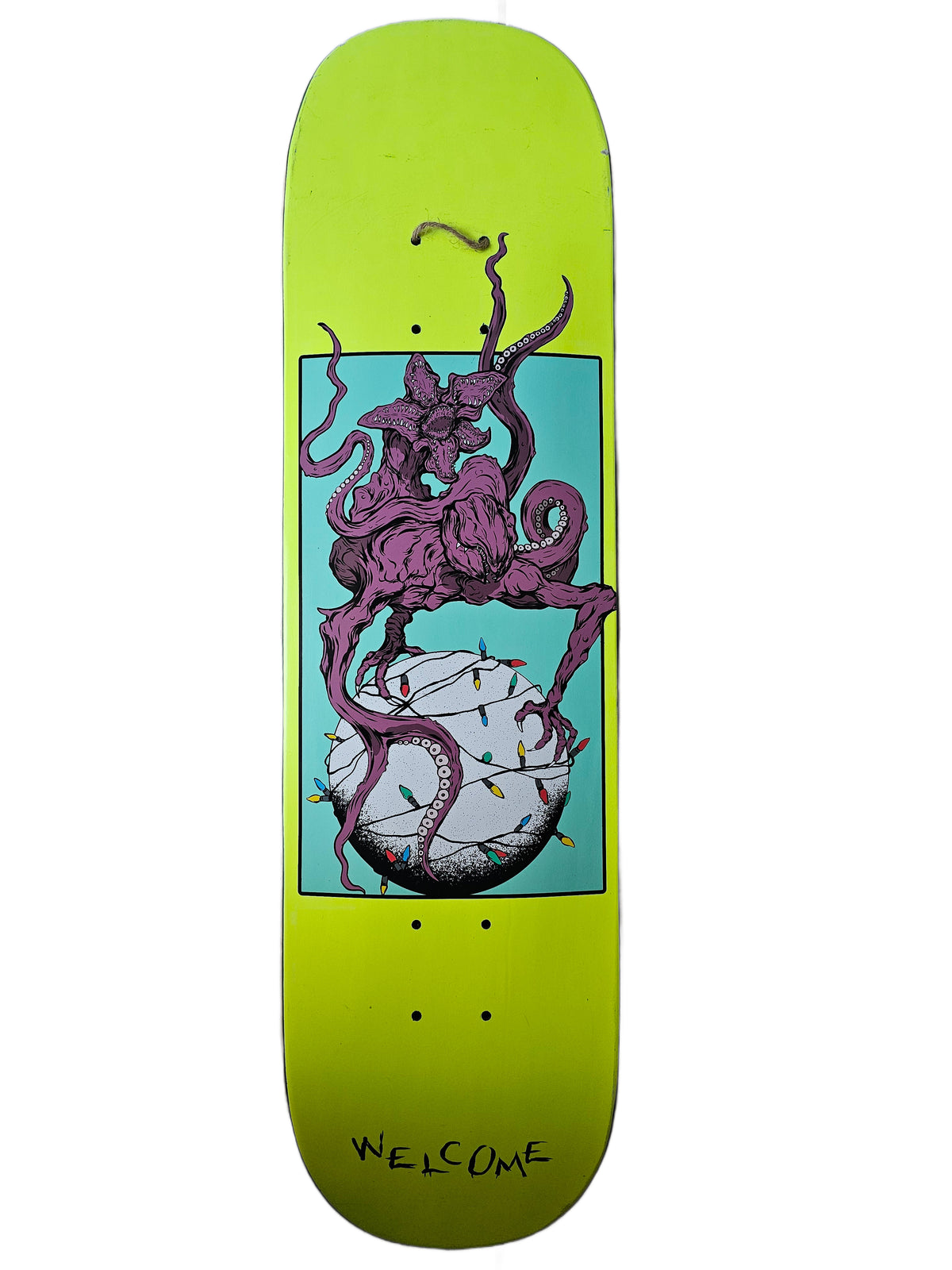 Welcome lime-green skateboard deck with purple tentacled creature graphic