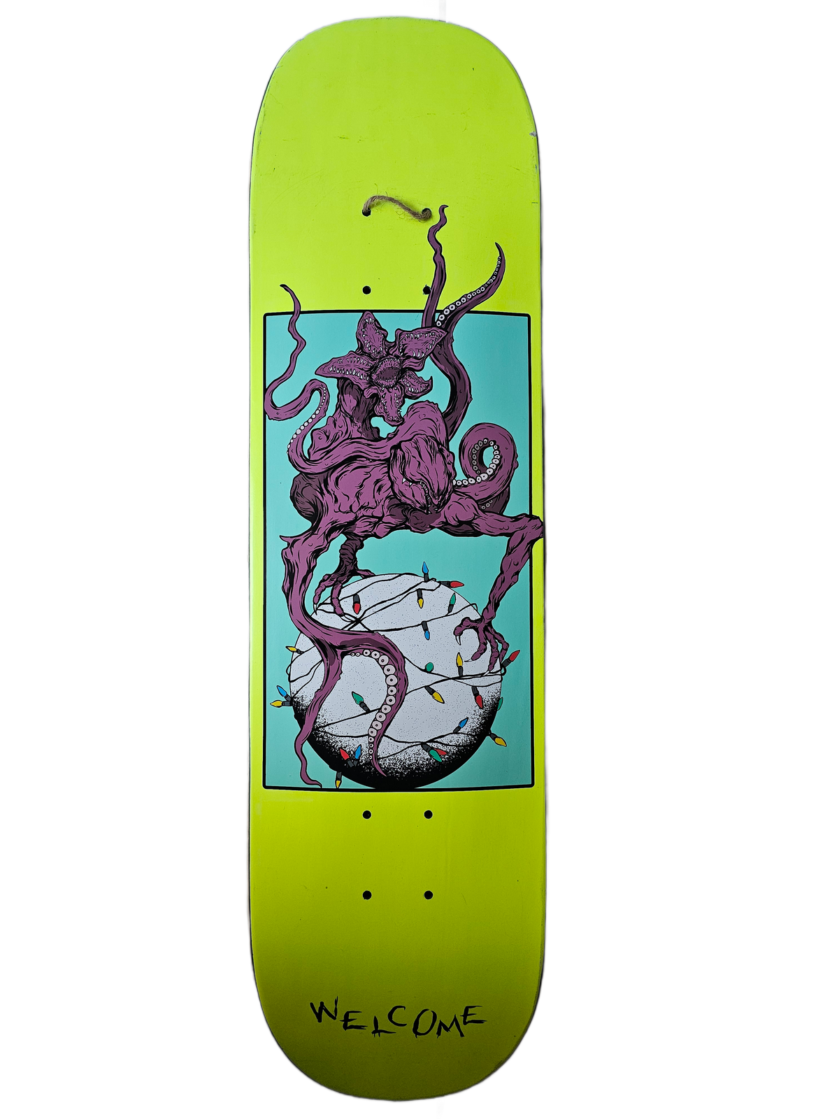 Cutout view of Welcome lime-green creature graphic deck