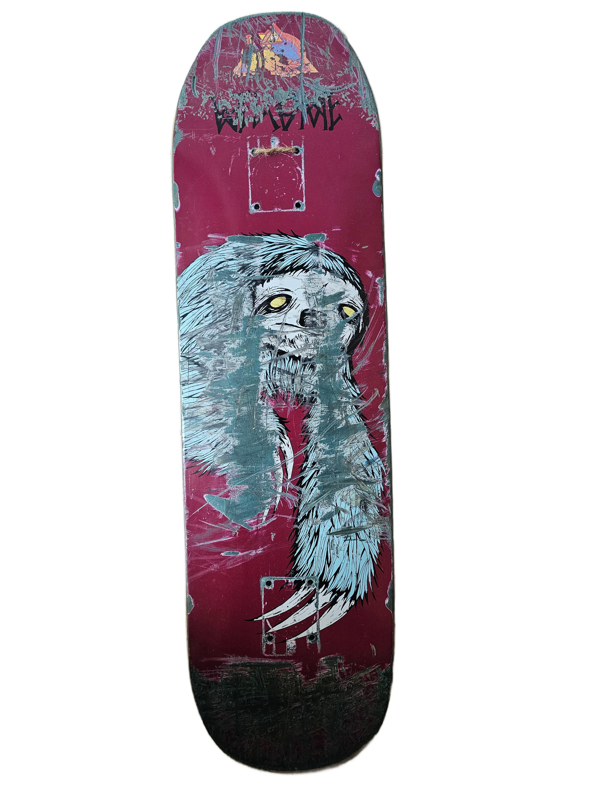 Heavily worn Welcome burgundy deck with yellow-eyed creature graphic