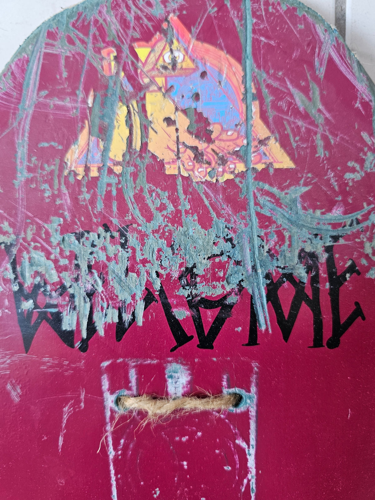 Close-up of extensive nose scratches, graphic loss and twine hanging cord
