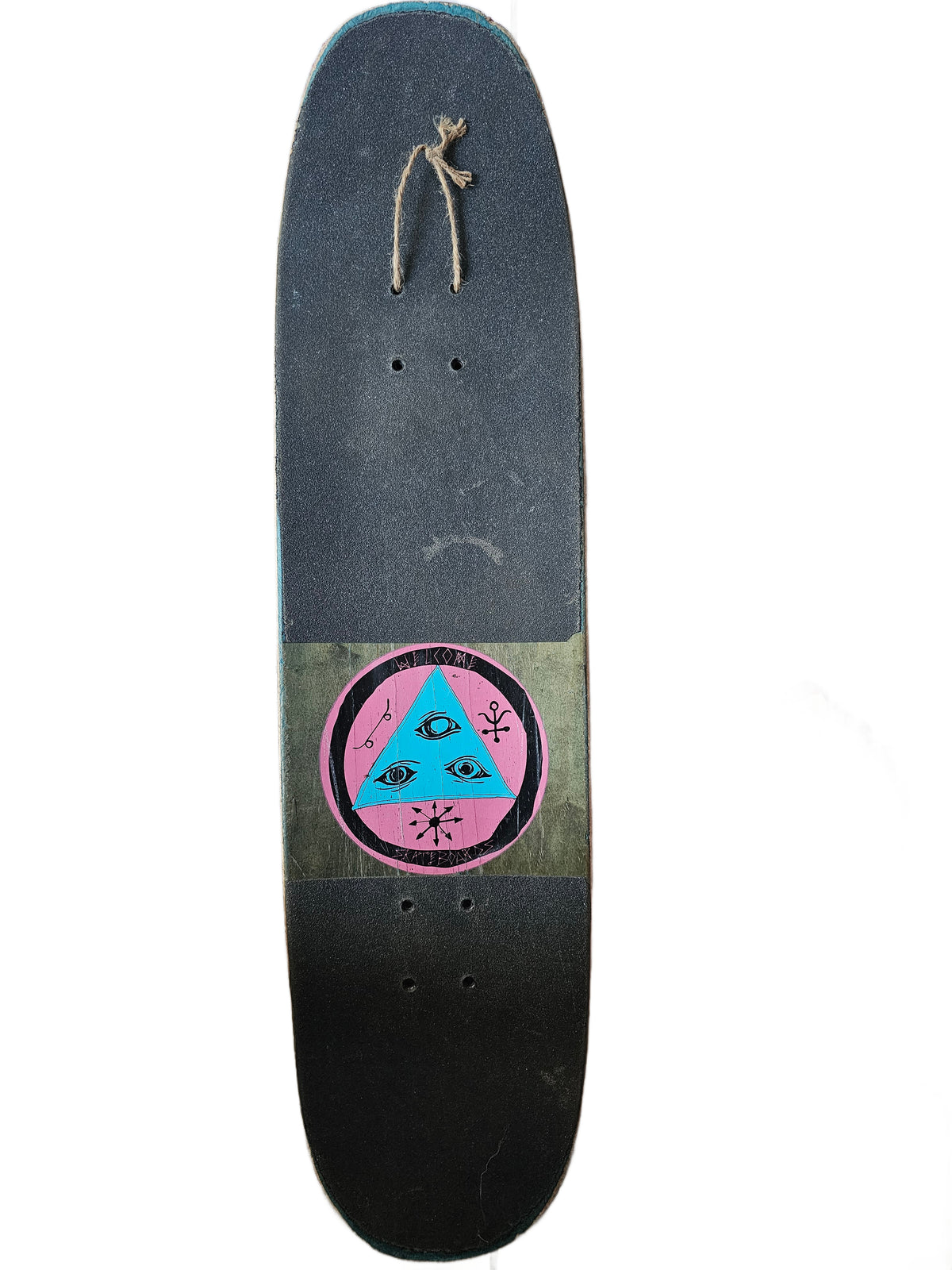 Grip-taped top with opening revealing pink-and-turquoise three-eye Welcome logo