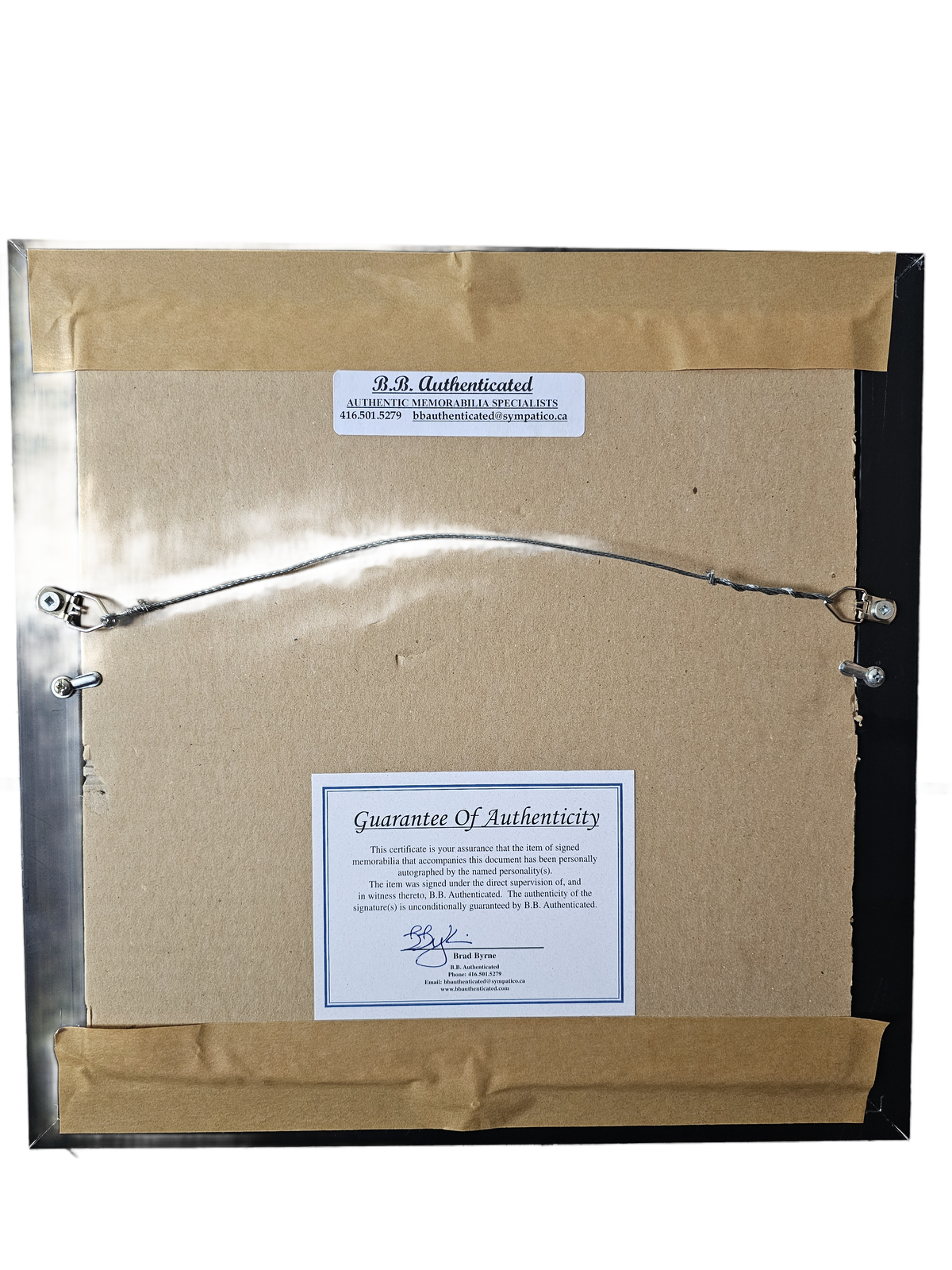 Rear of AC/DC frame with hanging wire and B.B. Authenticated certificate